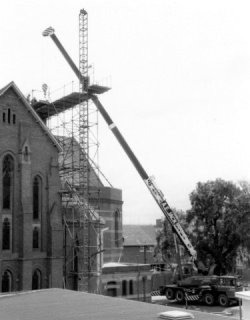 A long way up! Work under way on the new parapet during the renovations.
