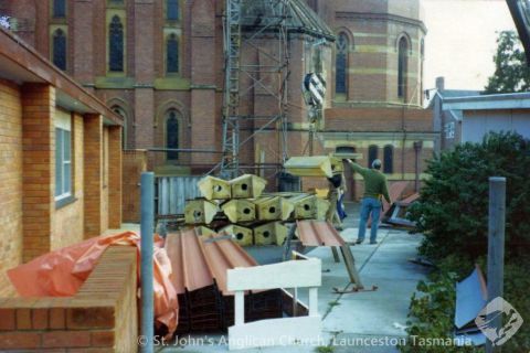 Parapet blocks being lifted